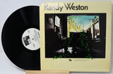 Vinyl record with cover featuring 'Randy Weston' on a light gray background