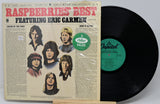Vinyl record with cover featuring 'Raspberries' Best' and 'Eric Carmen' on a gray background