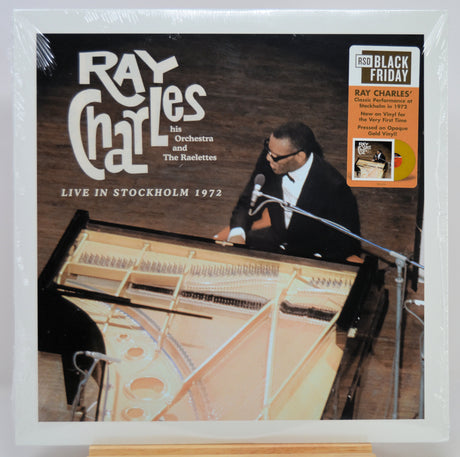 Ray Charles 'Live in Stockholm 1972' LP album in shrink wrap, featuring a photo of the pianist at a grand piano and a black Friday 150th anniversary sticker on the top right.