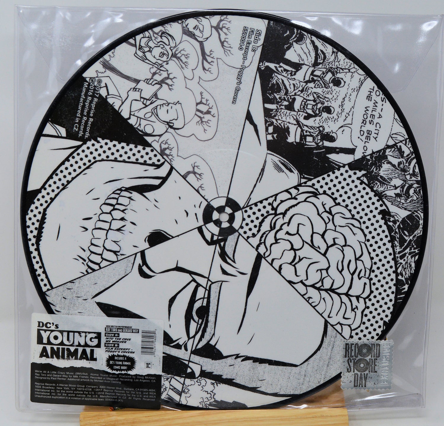 Vinyl record with black and white artwork and 'DC's Young Animal' label on a clear sleeve.