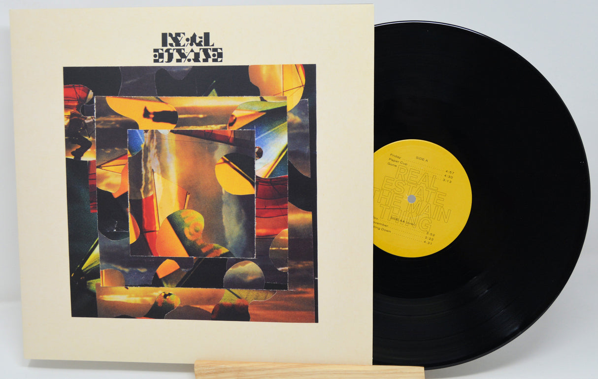 Vinyl record with a colorful cover on a white background