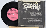 Vinyl record and cover for 'The Real Kids' with text and logo.