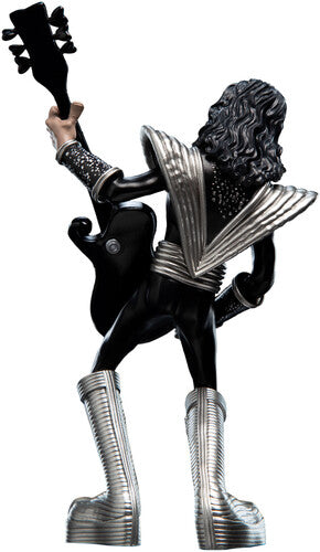 Back view of mini rock guitarist figurine showing costume details
