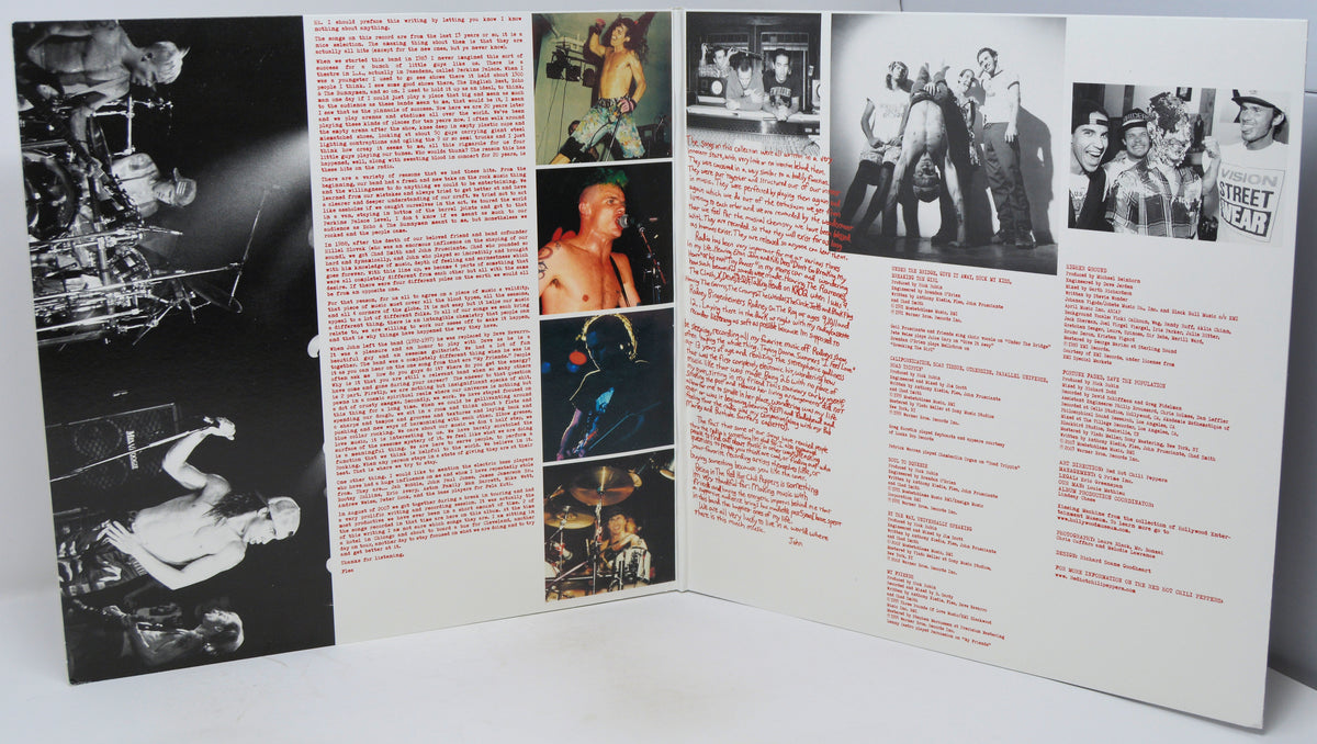 An open tri-fold booklet or printed program spread on a white surface, featuring black-and-white concert photographs, small color photos, columns of red and black text, and a few small printed images.