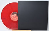 Translucent red Twin Peaks: Fire Walk With Me vinyl partially inside black sleeve