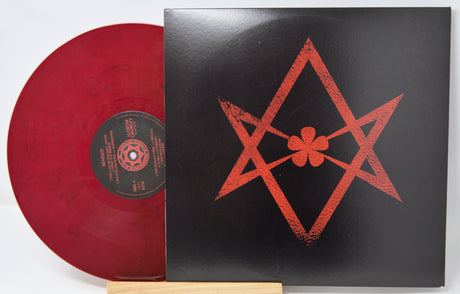 Red marbled vinyl record and sleeve featuring magical star sigil from Aleister Crowley Black Magic LP