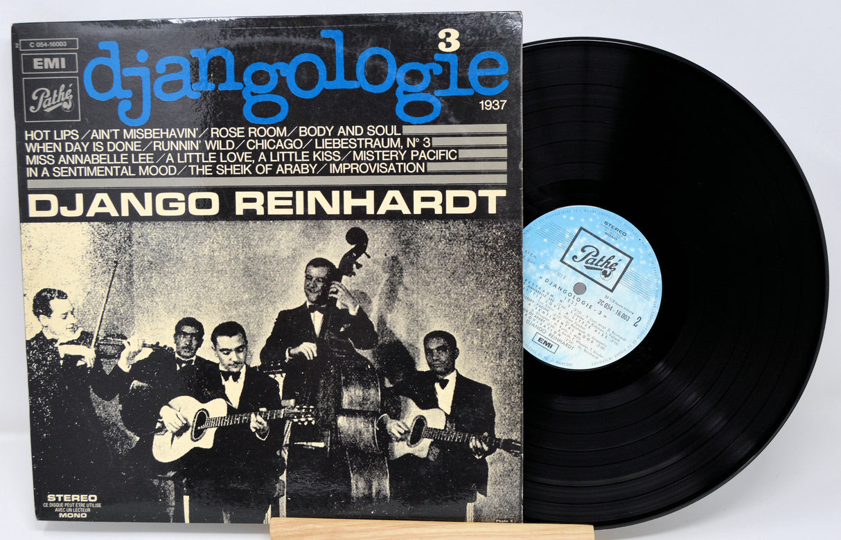 Vinyl record with cover featuring Django Reinhardt and EMI branding on a white background