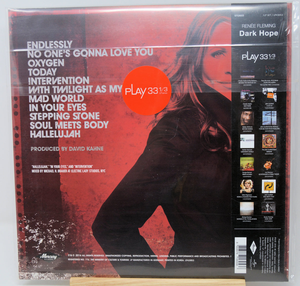 Vinyl record sleeve for Frank Sinatra's 'Dark Hope' album, sealed in plastic shrink wrap, photographed against a white background with a small wooden display block visible at the bottom.
