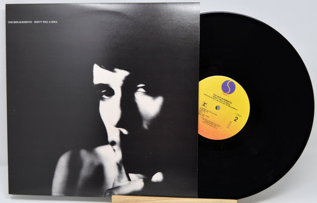 Vinyl record album with the cover partially pulled open, revealing a black LP. The cover features a high-contrast black-and-white portrait and the text 'THE BLACKSHOTS - DON'T TELL A MAN' at the top left.