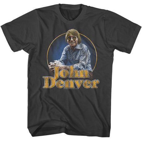 Vintage black t-shirt with a John Denver graphic and retro text design