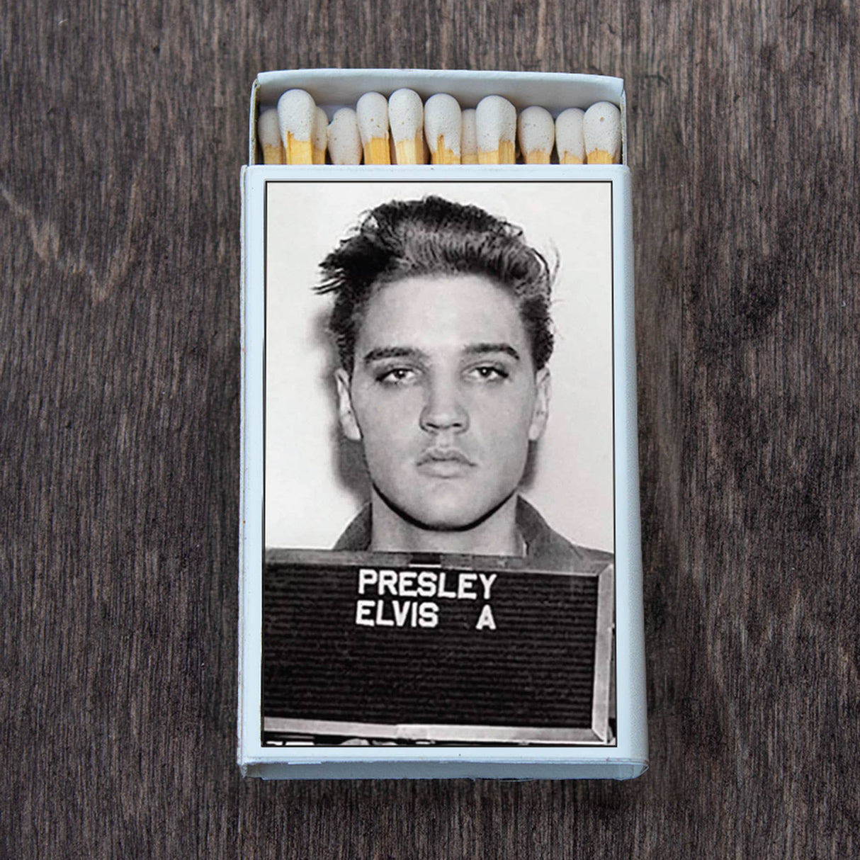 Open matchbox featuring a retro black and white mugshot print on top