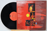 Chick Corea's 'Where Have I Known You Before' double vinyl LP set, showing the black record partially pulled from the back cover, which features a red-orange background with album artwork and track listings.