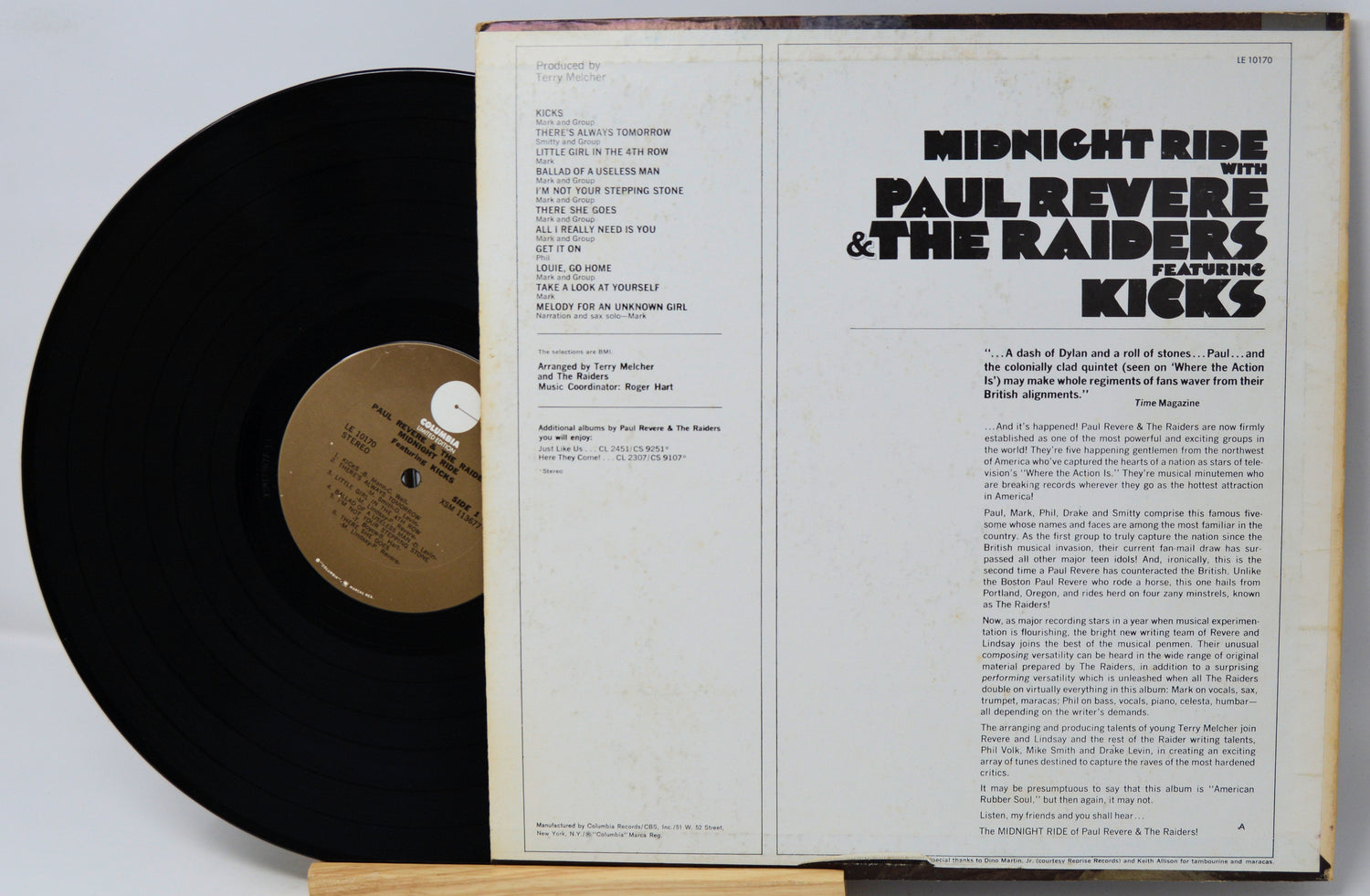 Vinyl record with cover featuring 'Paul Revere & The Raiders' and 'Kinks' on a white background