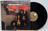 Vinyl record with cover featuring 'Midnight Ride with Paul Revere & the Raiders' on a white background