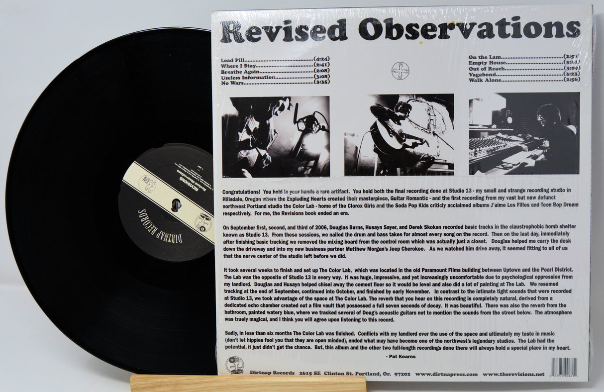 Vinyl record with cover displaying 'Revised Observations' text and album artwork.
