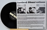 Vinyl record with cover displaying 'Revised Observations' text and album artwork.