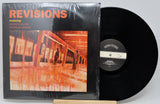 Vinyl record with cover titled 'Revisions' featuring Husayn Sayer and Douglas Burns, on a white background.