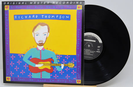 A vinyl record partially pulled from its illustrated album sleeve. The cover reads 'Original Master Recording' and 'Richard Thompson,' with a stylized portrait of a man playing a red guitar against a yellow and blue background.