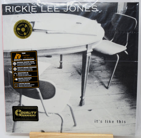 Rickie Lee Jones 'It's Like This' vinyl record album cover, showing a black and white photo of a table and chairs, with gold Quality Records stickers on the front.