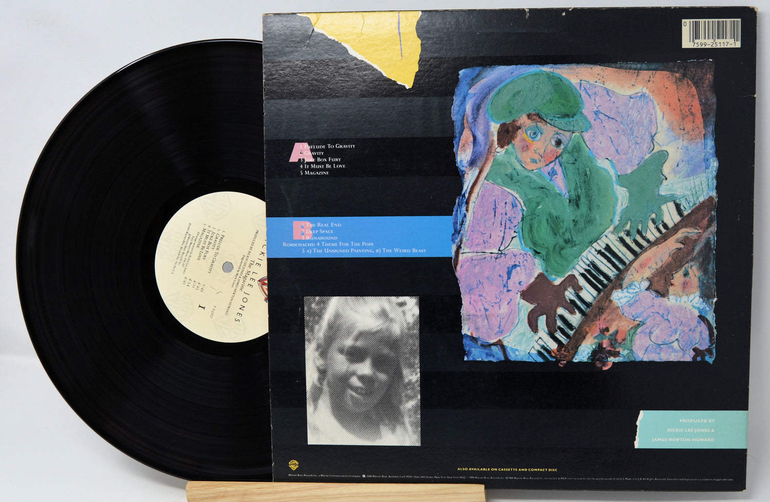 Vinyl record with a colorful cover featuring a person playing a keyboard.