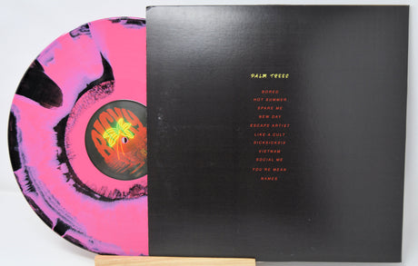 Vinyl record with colorful design on the left and black cover with text on the right, on a white background.