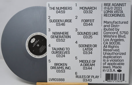 Vinyl record with label showing tracklist and branding