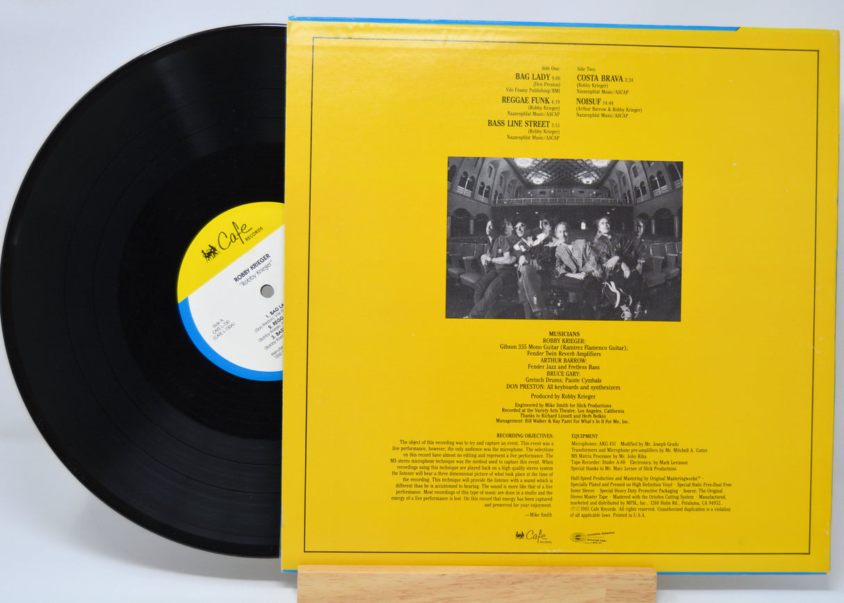 'Robby Krieger Self Titled' Vinyl record with yellow cover featuring text and a black and white photo.