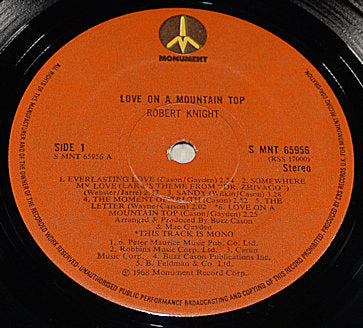 Close-up of the Robert Knight 'Love On A Mountain Top' vinyl LP label with tracklist and Monument Records logo