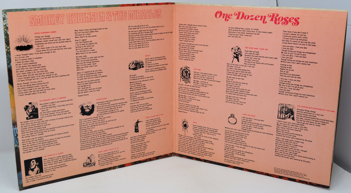 Open album cover with text and graphics on a white surface