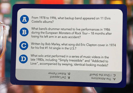 Music trivia question card featuring queries about famous rock bands and artists