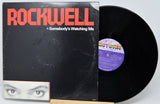 Vinyl record with 'Rockwell' album cover featuring a face and text.