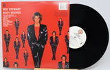Vinyl record with cover featuring a band on stage and 'Genesis Seconds Out' text.