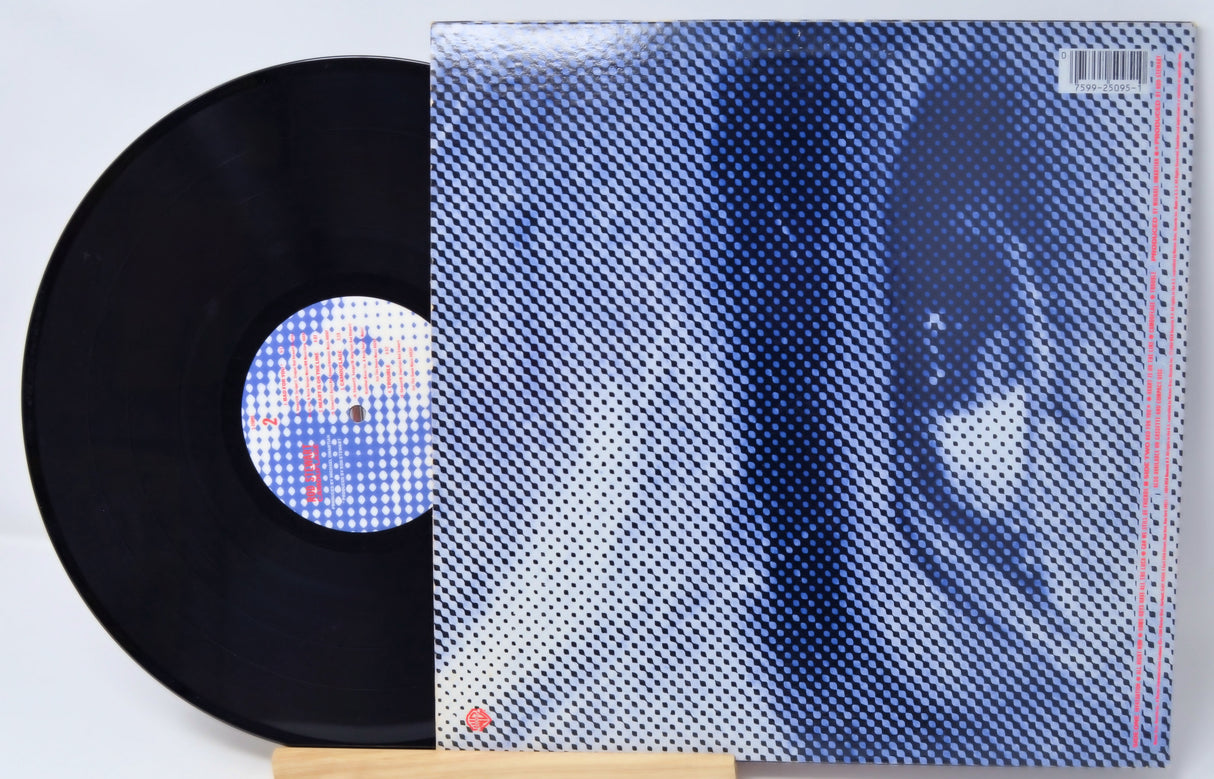 Vinyl record with a patterned cover on a white background