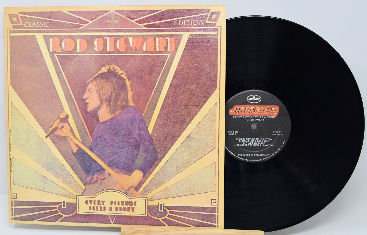 Vinyl record with cover featuring Rod Stewart on a light blue background