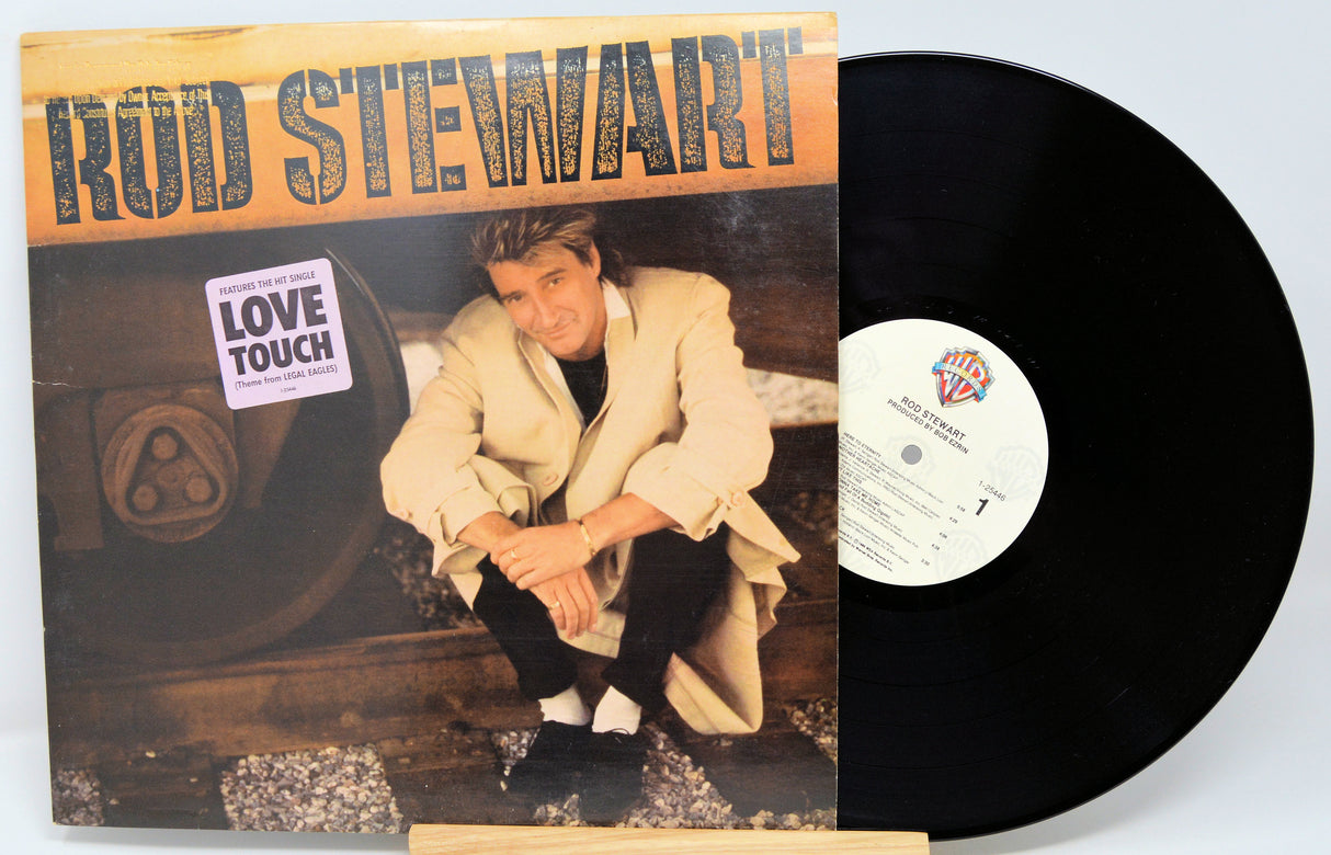 Vinyl record with cover featuring Rod Stewart and album title 'Love Touch'.
