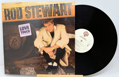 Vinyl record with cover featuring Rod Stewart and album title 'Love Touch'.