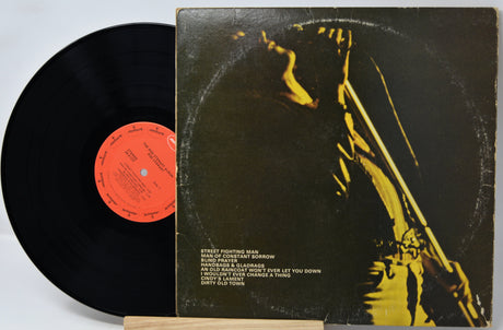 Vinyl record with cover featuring a person and text on a light gray background