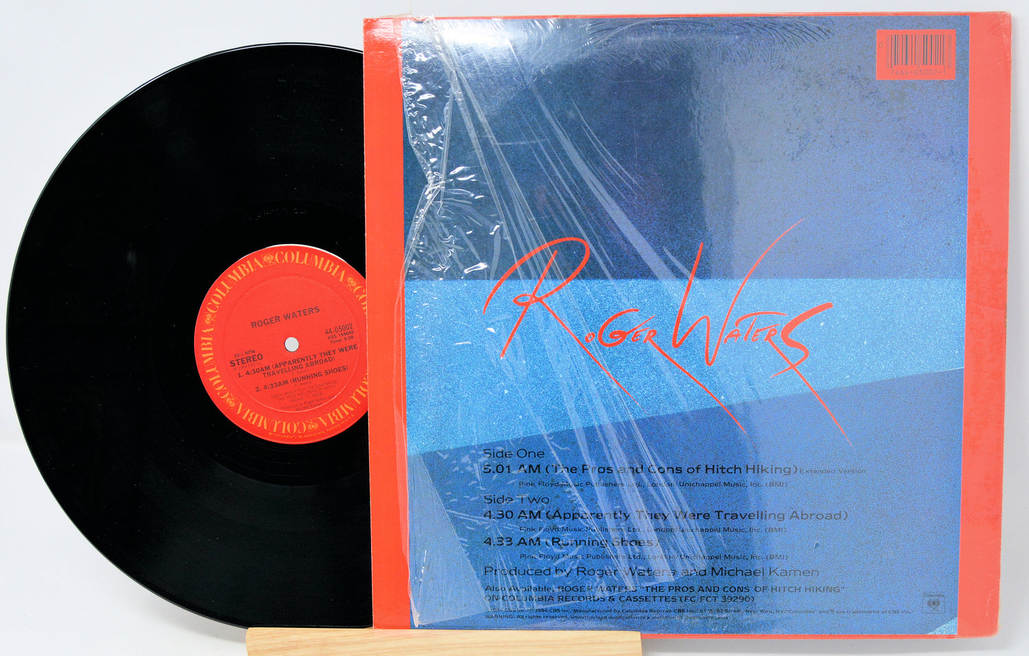 Vinyl record with red label and blue cover featuring 'Roger Waters' on a white background