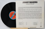 Vinyl record with cover displaying 'Jimmy Rogers Chicago Bound' on a white background