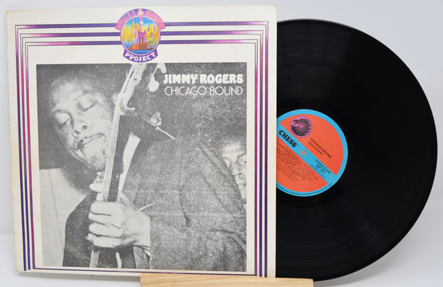 Vinyl record and cover featuring Jimmy Rogers with a jazz instrument, on a light gray background.