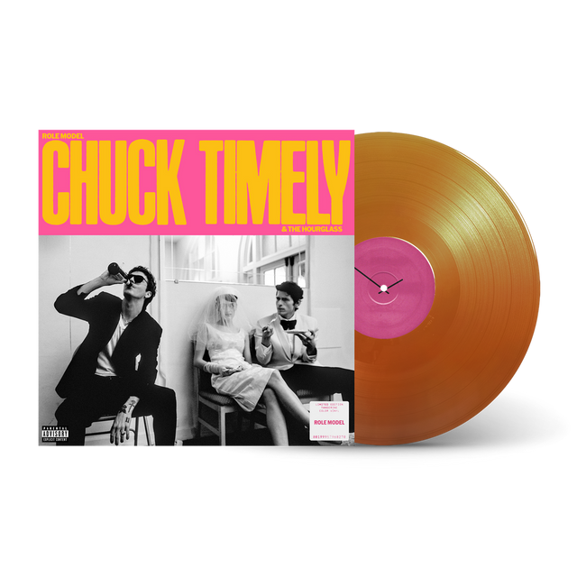 Vinyl record with a pink label and orange disc on a white background