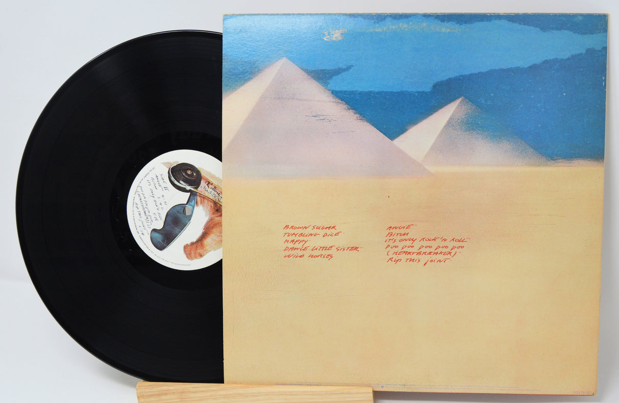 Vinyl record by the Rolling Stones titled 'Made In The Shade' with cover art featuring pyramids and desert landscape and song titles in text.