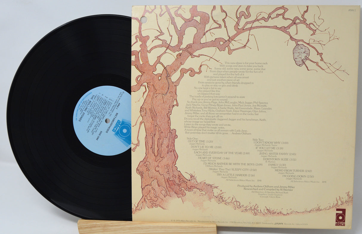 Vinyl record with a detailed tree design on the cover