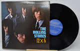 Vinyl record with cover featuring The Rolling Stones, on a white background