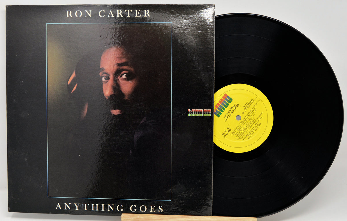 Ron Carter's 'Anything Goes' vinyl record LP, showing the black album cover with a portrait and the black record partially pulled out, revealing a yellow label.