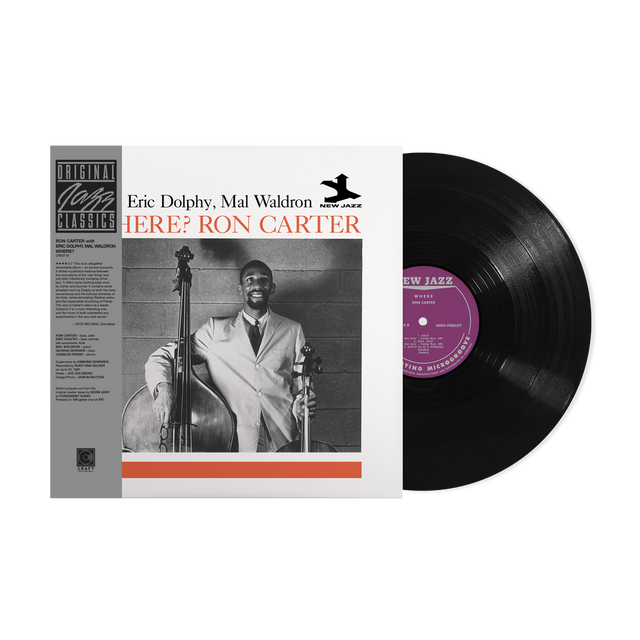 Vinyl record with cover featuring a musician holding a bass, on a white background