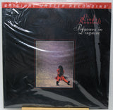 Linda Ronstadt's 'Lizonez in Disguise' original master recording vinyl LP album cover, sealed in its original plastic shrink wrap. The cover is predominantly black with a red banner at the top and a central square album art photo depicting Linda Ronstadt in a red outfit.