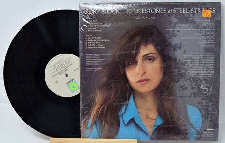 Vinyl record with cover featuring a person's portrait on a light blue background