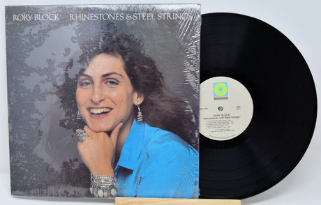 Vinyl record with cover featuring a person, on a light gray background