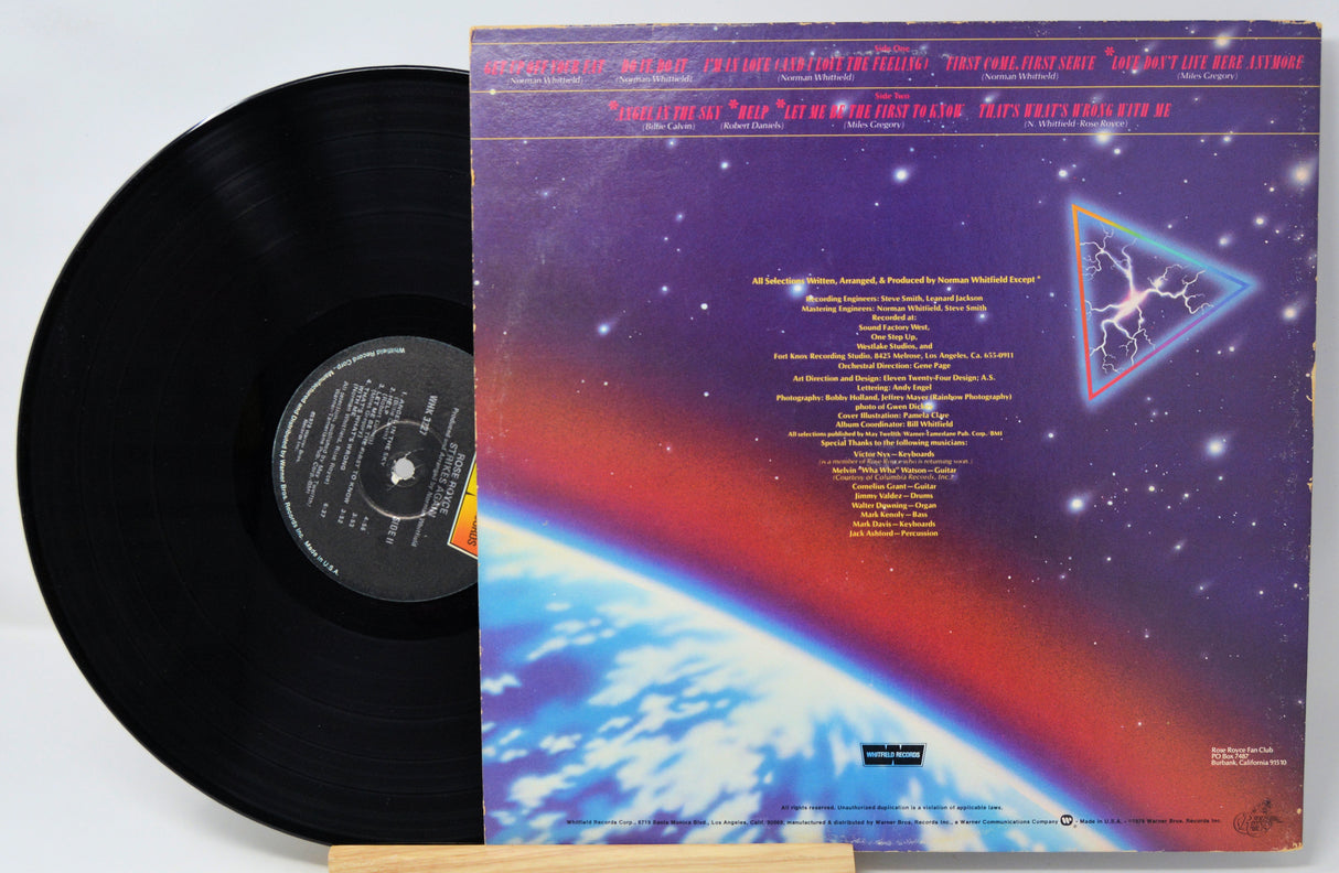 Vinyl record with a colorful album cover featuring space-themed design